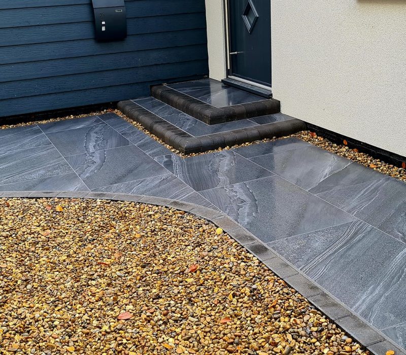 small gravel driveway with path